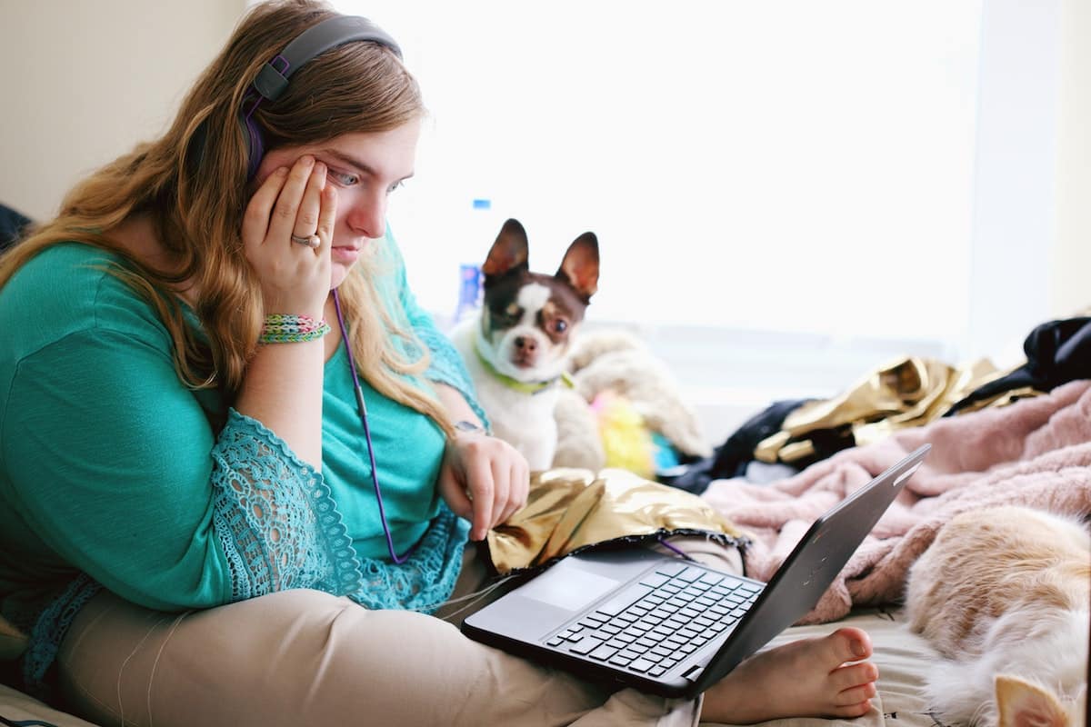 woman on laptop searching for how to pay off 100k in student loans