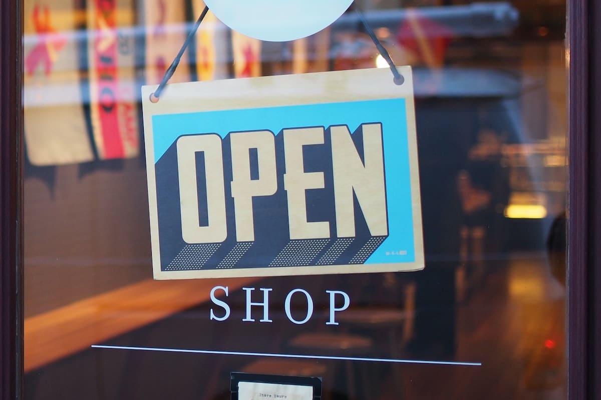 Open sign on a clear glass window.