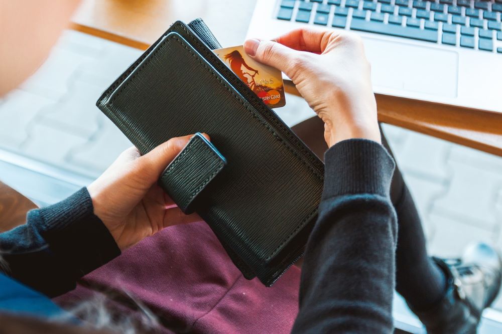 woman looking through her purse