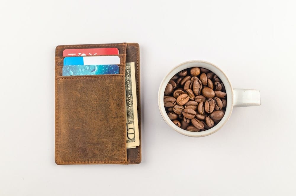 photo of a wallet and coffee