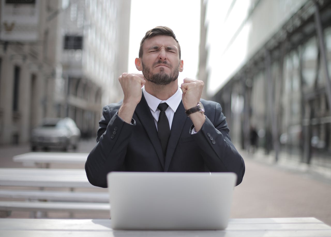 photo of freelancer happy looking at his computer