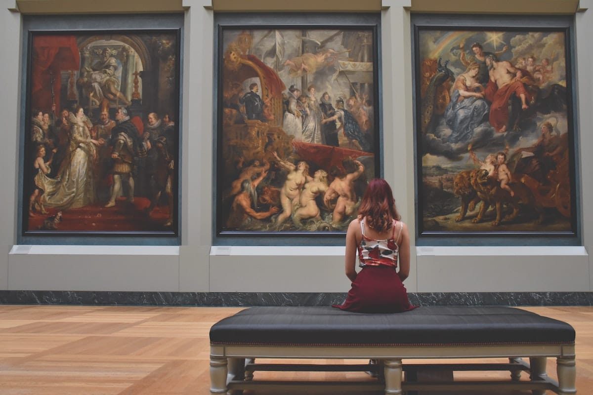 woman looking at an art gallary